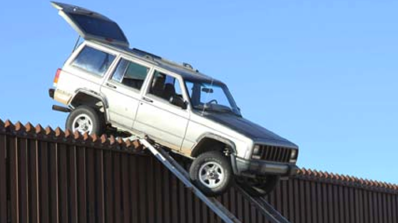 Illustration for article titled The U.S. Border Patrol Found This Jeep Stuck On Top Of The Border Fence